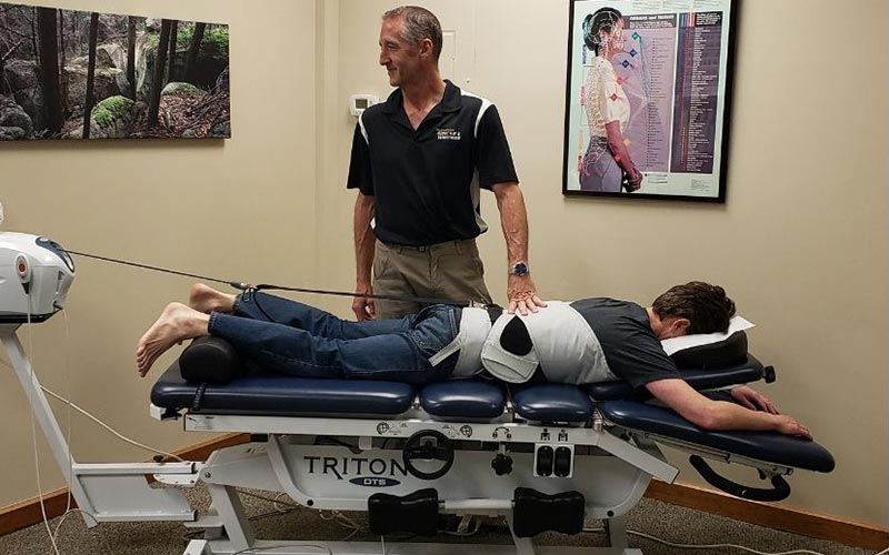 A photo of a patient receiving Spinal Decompression Therapy.