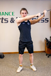 Standing Diagonal exercise demonstrated by a young man